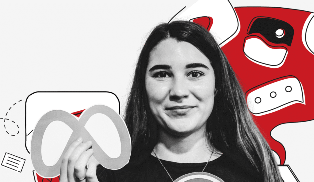 Die Werkstudentin Michelle welche das Logo von Meta hochhält.